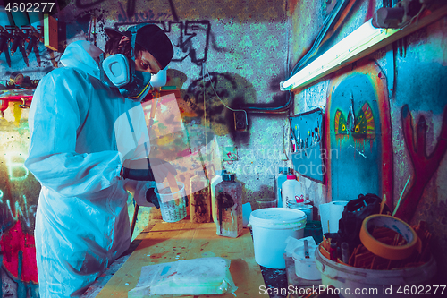 Image of Skater in process of making his own skateboard, longboard - open business concept