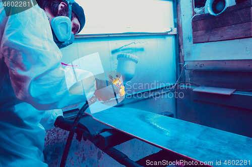 Image of Skater in process of making his own skateboard, longboard - open business concept