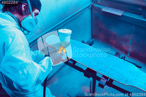 Image of Skater in process of making his own skateboard, longboard - open business concept