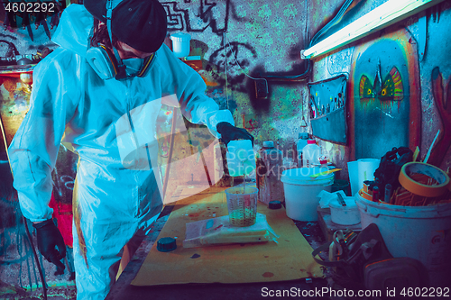 Image of Skater in process of making his own skateboard, longboard - open business concept