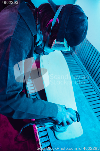 Image of Skater in process of making his own skateboard, longboard - open business concept