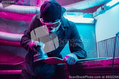 Image of Skater in process of making his own skateboard, longboard - open business concept