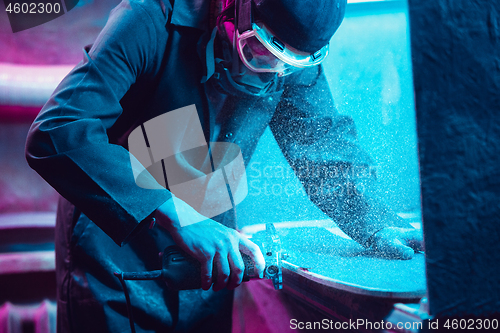 Image of Skater in process of making his own skateboard, longboard - open business concept