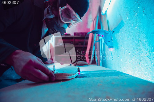 Image of Skater in process of making his own skateboard, longboard - open business concept