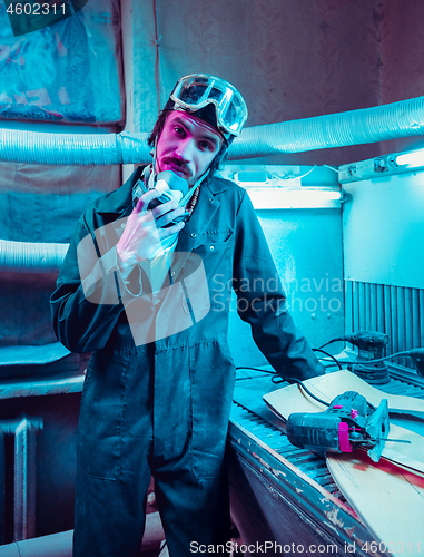 Image of Skater in process of making his own skateboard, longboard - open business concept