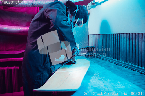 Image of Skater in process of making his own skateboard, longboard - open business concept