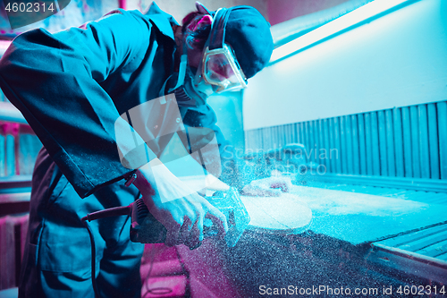 Image of Skater in process of making his own skateboard, longboard - open business concept