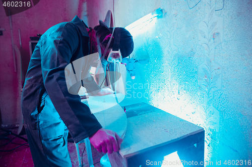 Image of Skater in process of making his own skateboard, longboard - open business concept