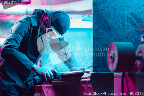 Image of Skater in process of making his own skateboard, longboard - open business concept