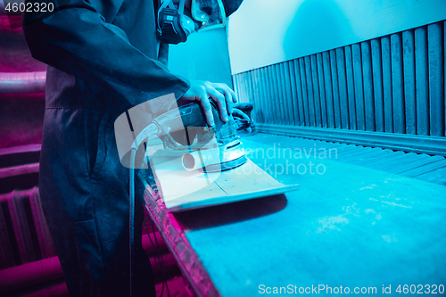 Image of Skater in process of making his own skateboard, longboard - open business concept