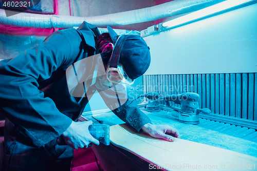 Image of Skater in process of making his own skateboard, longboard - open business concept
