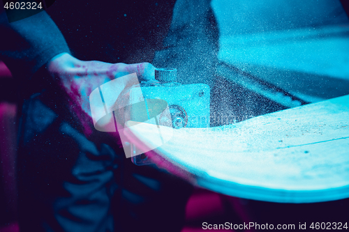 Image of Skater in process of making his own skateboard, longboard - open business concept