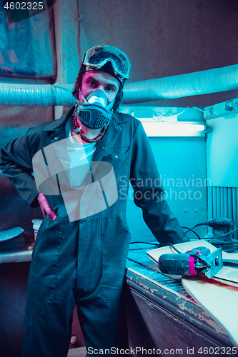 Image of Skater in process of making his own skateboard, longboard - open business concept