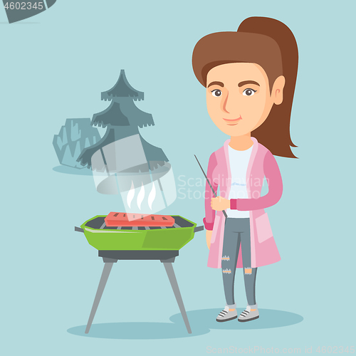 Image of Caucasian woman cooking steak on the barbecue.