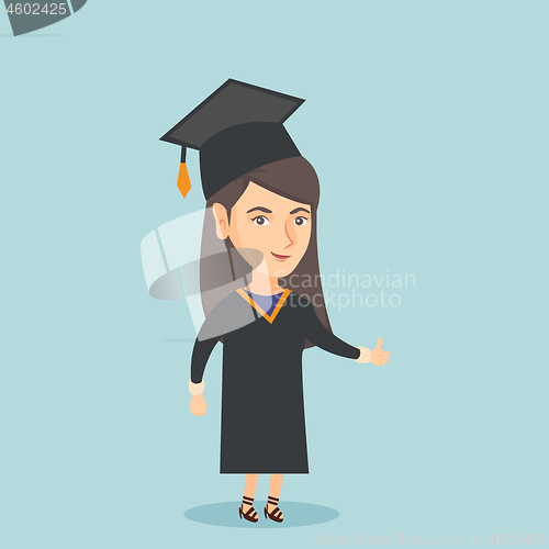 Image of Young caucasian graduate giving thumb up.
