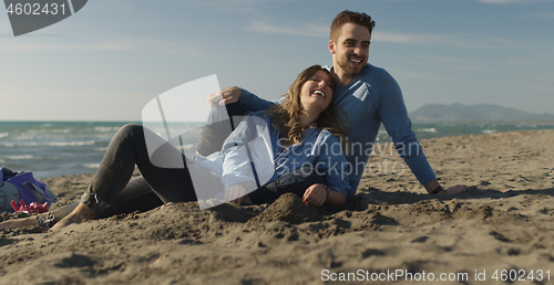 Image of Couple enjoying time together at beach