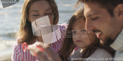 Image of Young family enjoying vecation during autumn