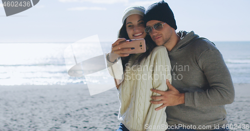 Image of Gorgeous couple taking picture of herselfe