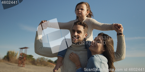 Image of Young family enjoying vecation during autumn