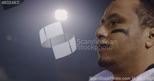 Image of portrait of young confident American football player