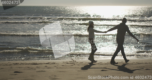 Image of Romantic Couple Relaxing On The Beach