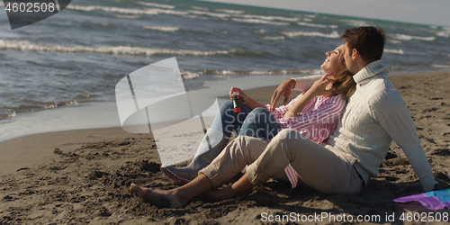 Image of Couple enjoying time together at beach