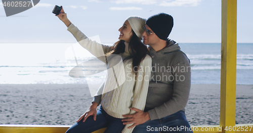 Image of Gorgeous couple taking picture of herselfe