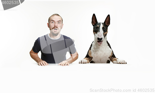 Image of Emotional Portrait of a man and his shepherd dog, concept of friendship and care of man and animal