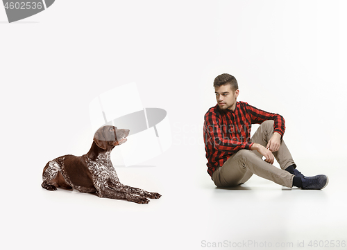 Image of Emotional Portrait of a man and his dog, concept of friendship and care of man and animal