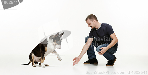 Image of Emotional Portrait of a man and his shepherd dog, concept of friendship and care of man and animal