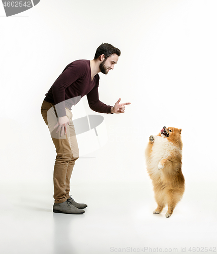 Image of Emotional Portrait of a man and his dog, concept of friendship and care of man and animal