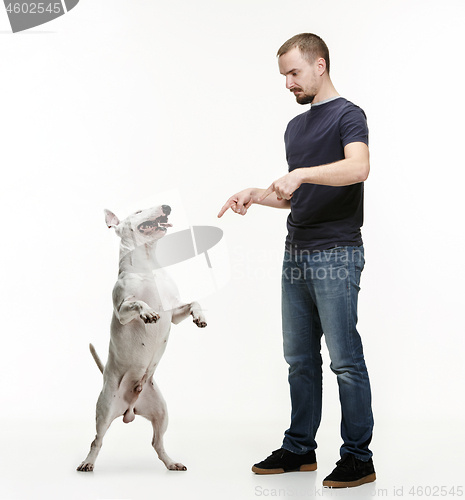 Image of Emotional Portrait of a man and his shepherd dog, concept of friendship and care of man and animal