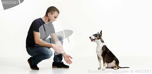 Image of Emotional Portrait of a man and his shepherd dog, concept of friendship and care of man and animal