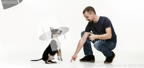 Image of Emotional Portrait of a man and his shepherd dog, concept of friendship and care of man and animal