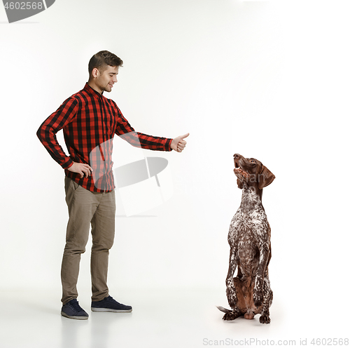 Image of Emotional Portrait of a man and his dog, concept of friendship and care of man and animal