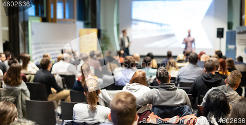 Image of Business speaker giving a talk at business conference event.