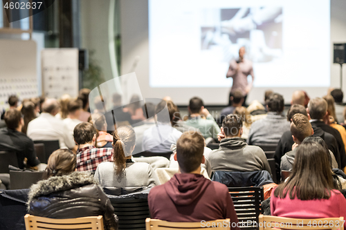 Image of Business speaker giving a talk at business conference event.