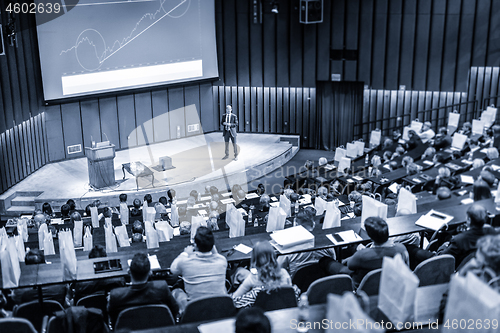 Image of Speaker giving presentation on business conference event.