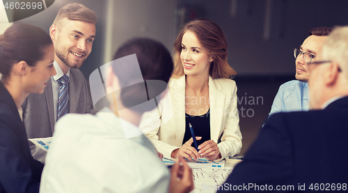 Image of business team with scheme meeting at office