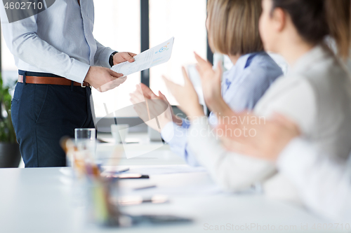 Image of business team at office meeting or presentation