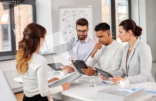 Image of team of recruiters with tablet pc at job interview