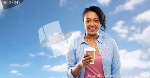 Image of happy african american woman drinking coffee