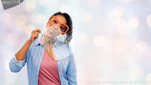 Image of happy african american woman with big glasses