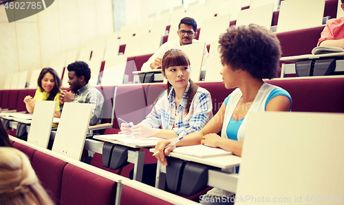 Image of group of international students talking on lecture