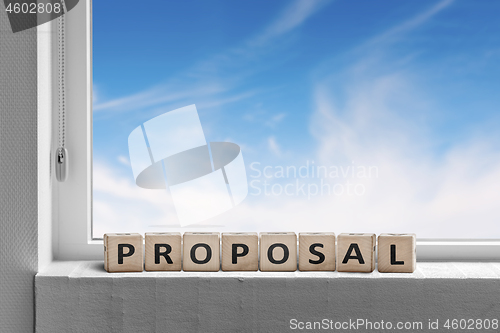 Image of Proposal sign in a window with a view to a heavenly