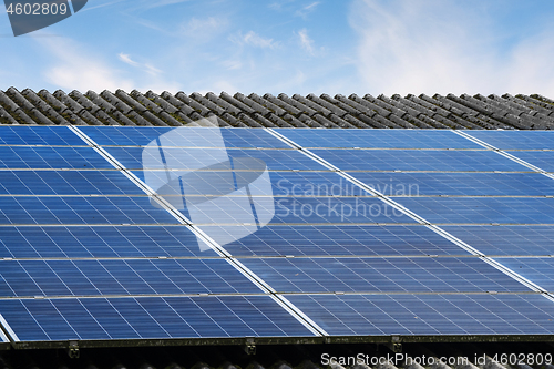 Image of Sun panels on a roof in bright daylight