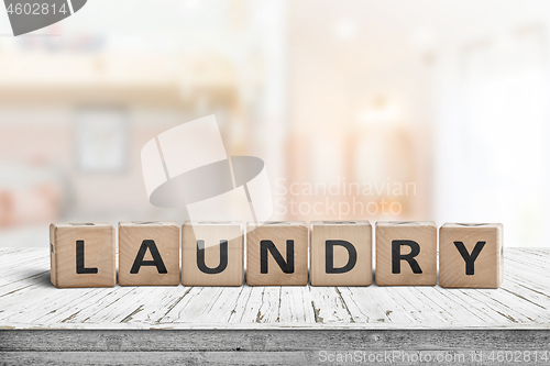 Image of Laundry sign on a white table