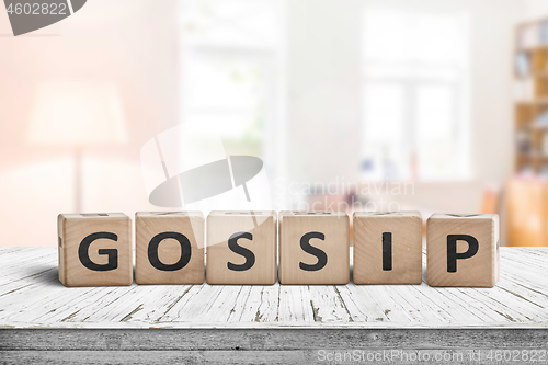 Image of Gossip text sign in a bright living room