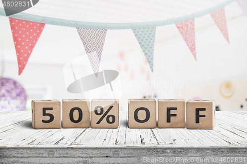 Image of Special price 50 percent off promotion sign