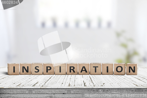 Image of Inspiration sign on a wooden table